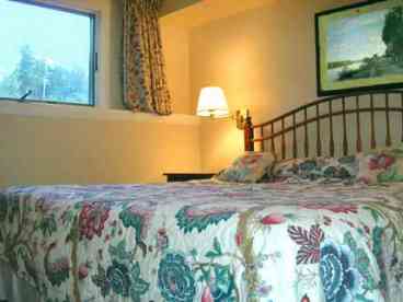 Master bedroom in our Stowe Rental Lodging with mountain views
