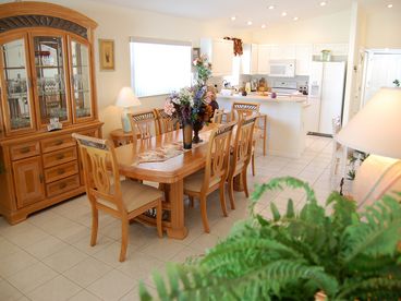 This view of the Dining Area also shows the Kitchen in the Background
