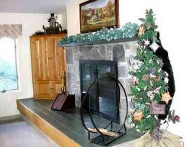 Stone fireplace with slate sitting ledge at resort rental townhouse New England