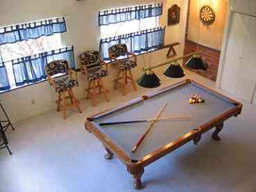 Enjoy a fun time playing pool, shooting darts, watching tv or just lounging around.