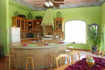 Main kitchen with island and boveda ceilings with spectacular views.