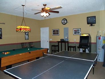 Game Room featuring an 8 ft pool table, Ping Pong Table and Video Arcade System