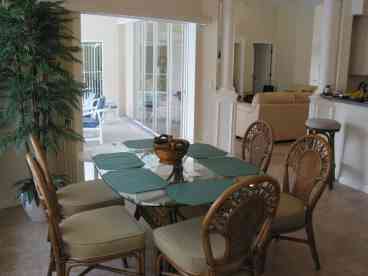 Spacious dining area adjacent to Kitchen opens out onto Lanai