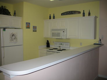 Full-Size Kitchen has Refrigerator, Oven, Microwave, Dishwasher, and Appliances