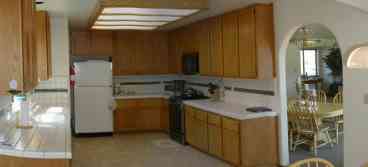 Spacious, fully equipped modern kitchen.  Gas range, microwave, dining service for 14.