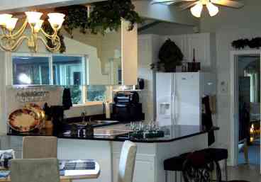 Open Center Kitchen with all new appliances.  Dishwasher, Cooktop Range, Convection/regular oven, Refrigerator with water/ice dispenser, microwave, coffeemaker & coffee grinder