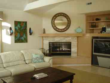Great room with big screen t.v., fireplace,and sliding glass doors to deck.