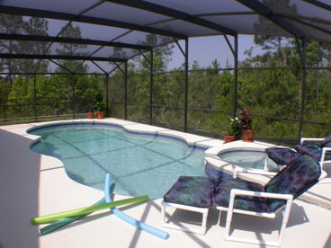 Here you can see our pool and spa are very private having trees to the rear and left side. The deck has been extended to give plenty of space to relax on the luxury 