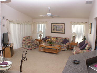One of two living areas in our house. Patio doors lead out to the extended deck and pool area. There is also a 42\
