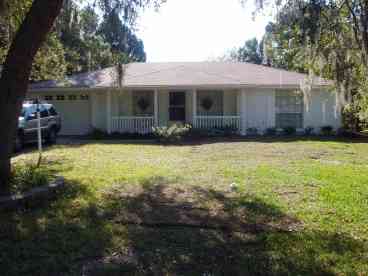 front view of the house with enclosed garage 