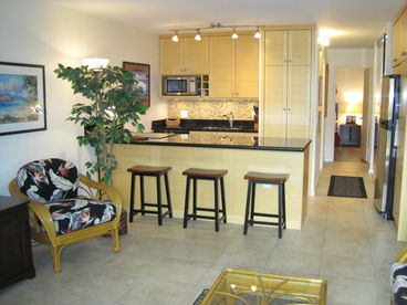 Remodeled kitchen with stainless steel appliances, granite counters and custom cabinets stocked with all you would need.