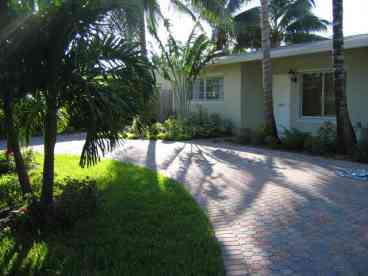 The circle paver drive is enclosed in a 10 foot fichus hedge.