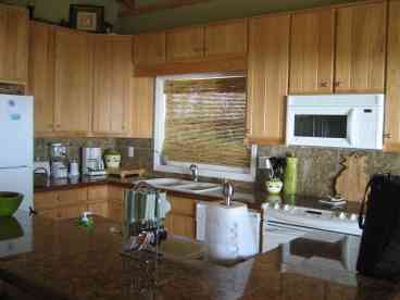 Gourmet kitchen w/ anything you need from blender to wet bar. Granite counter tops filtered water, micro, and much more.
