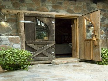 Enter through these magnificent black walnut doors to our magical cabin