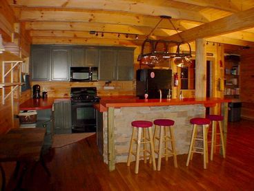 View of kitchen area and breakfast bar