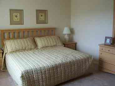 King size double bed, on suite large bath & shower, 'walk in' cupboard 