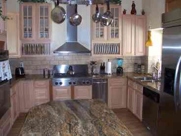 Kitchen, Granite countertops, Maple Cabinets and KitchenAid Stainless Steel appliances.