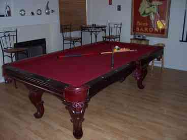 Check this pool tabke out. Real wood and fancy.