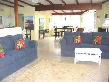 Living room features terrazzo tile floors and new furniture.