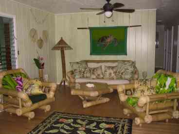 Relax in the tropically decorated, comfy living room.