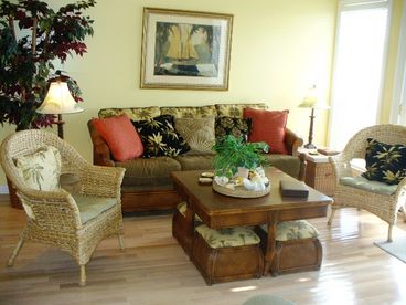 Living room opens to large deck overlooking pool and Gulf 