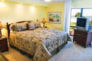 Master Bedroom with TV & Celing Fan--View of Gulf in B306.  Wake up to a view.
