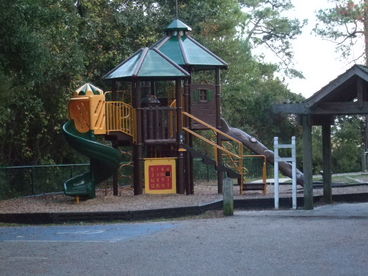 Children\'s park at end of block near marsh walkway.