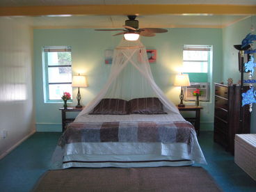 Oceanfront suite has a/c, private bathroom with outdoor shower and king bed and three twin beds.