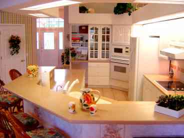 Large, fully equipped kitchen with breakfast bar