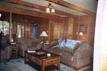 Large Livingroom!  Kick back and pick a DVD movie from a list of over 100 titles and relax by the fire in the vintage fireplace. 