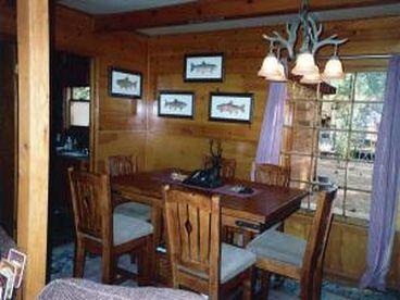 Formal dining room for 8.  Have a great family meal TOGETHER with the kids and tell your fish stories