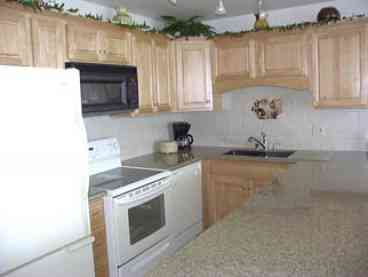Kitchen with granite slab countertops