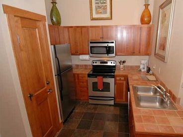 Kitchen with brand new stainless appliances.