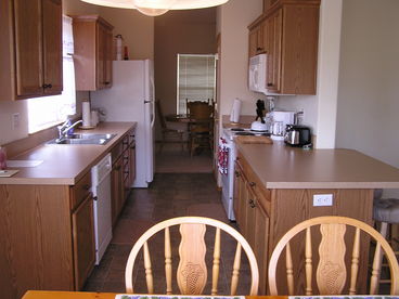 Walk through kitchen complete with organic coffee and grinder.