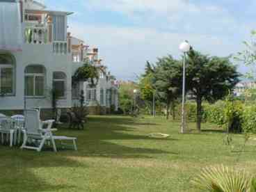 Outside: A delightfull garden area with table & chairs plus loungers for outside dining and relaxation.