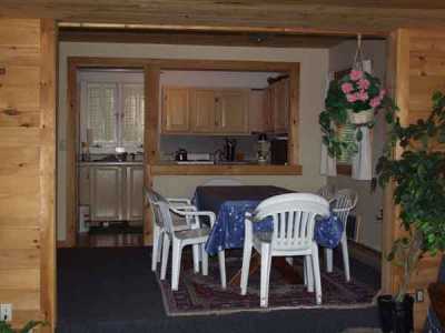 Looking from living room toward kitchen.All three rooms are open with views to the lake. Pine and sheetrock interior finish.