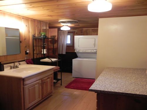 bathroom with plenty of space, washer/dryer