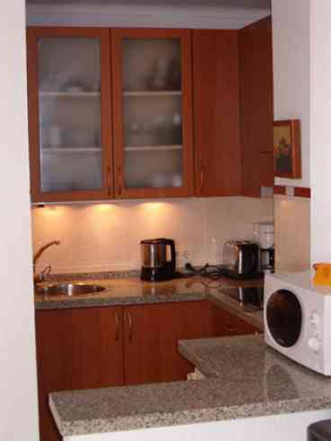 Kitchen area: Modern kitchen with ceramic hob, fridge, microwave, kettle, toaster, coffee maker and crokery and cuttlery.An iron and ironing-board also provided. 

