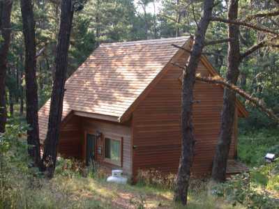 The Guest house, which has a queen loft bedroom and a queen sleep sofa in the living room below, lies down a short path from the main house.