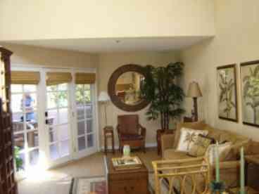 Living room with vaulted ceilings and skylights