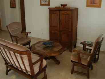 Lounge/Dining area: Good sized open-plan lounge/diner with patio doors to the balcony. Furnished with sofa and two armchairs,colour TV (english channels) & DVD player, also a dining table and 4 chairs. 

