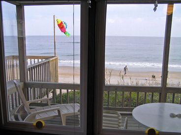 Roomy screened shaded porch with dining & relaxing furniture and wonderful beach breezes & overview.