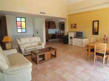 Open plan great room with vaulted ceilings
