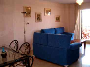Lounge/Dining area: Good sized open-plan lounge/diner with patio doors to the private garden, furnished with a dining table and 6 chairs, 2 sofas and colour TV with international channels. 

