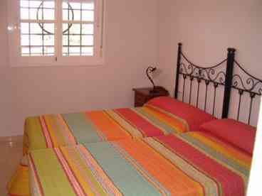 Bedroom 1: Extremely spacious double bedroom furnished with twin beds, colour TV, bedside cabinets and fitted wardrobe with hanging space and drawers. 

Modern En-Suite Bathroom:  with bath/shower, toilet, bidet and basin. 