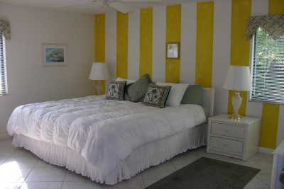 This is the master bedroom in the condo and features a king size bed and private bathroom with shower.  