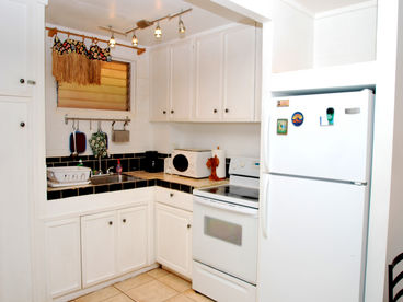 Kitchen Area - Stove, Refrigerator, Microwave, Coffee Maker & filters, Toaster, Blender, Pots & Pans, and Utensils.
