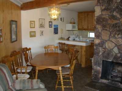 Dining room maple table & chairs,gas log fireplace.