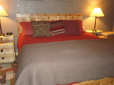 King Size bed with quality matress and down matress pad.  Ski Racks skis, jackets, and other gear