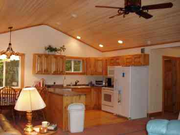 Fully equipped kitchen with dining room, range/oven, dishwasher, refrigerator, coffee pot, toaster oven, lobster/clam pot, dishes, utensils & more